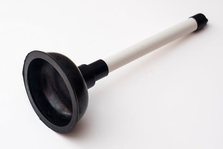 Use a plunger to repair a clogged shower drain solution.