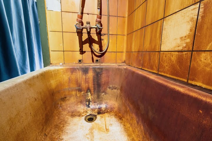 The bathtub doesn't hold water because of corrosion.