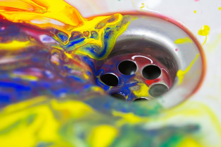 Can you pour paint down the drain?