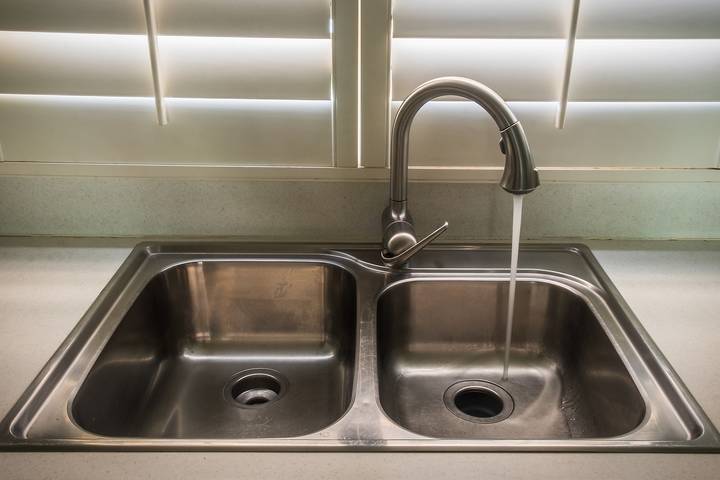 A faucet cartridge problem explains why there is low water pressure in kitchen sink.