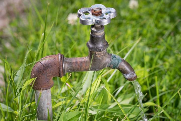 You may have a leaking outdoor faucet if you have pooling water in the yard.