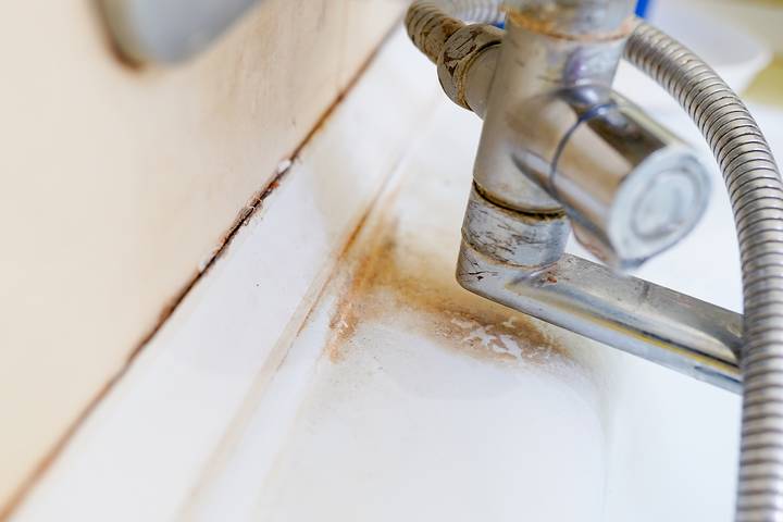 Contact a plumber to remove rust stains from sink.