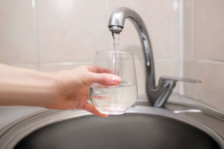 Blocked pipes may cause low water pressure in kitchen sink.