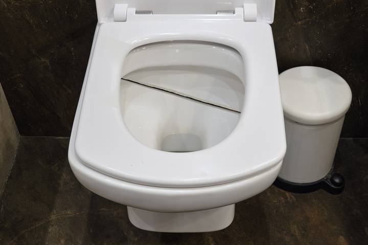 A cracked bowl causes a low water level in the toilet.