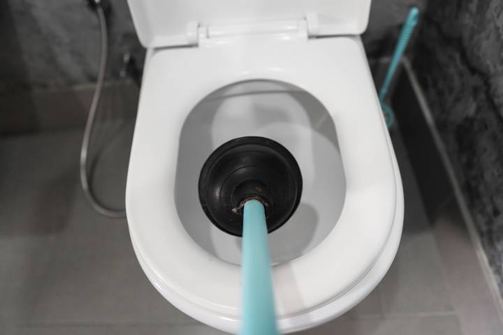 Clogged sinks and toilets are common signs of a clogged sewer line.