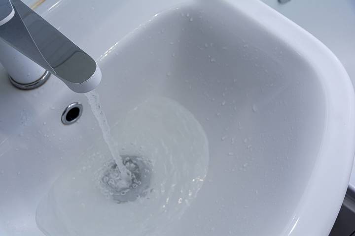 A slow-draining sink is a common sign of a clogged sewer line.