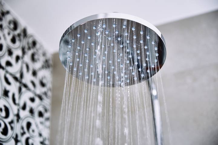 The shower water is cold and freezing due to the hot water usage.